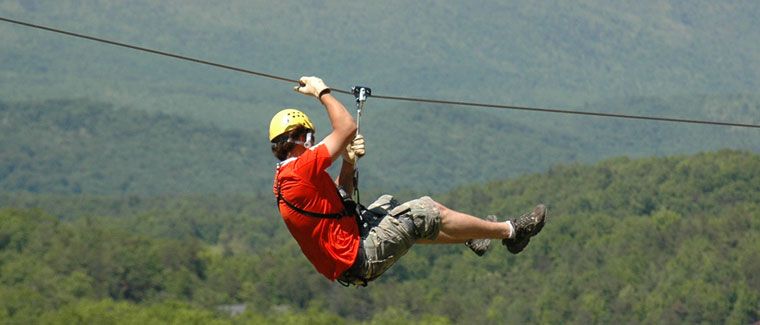 Active zip line brake with leather gloves