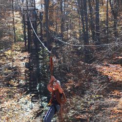 Gravity based zip line brake system